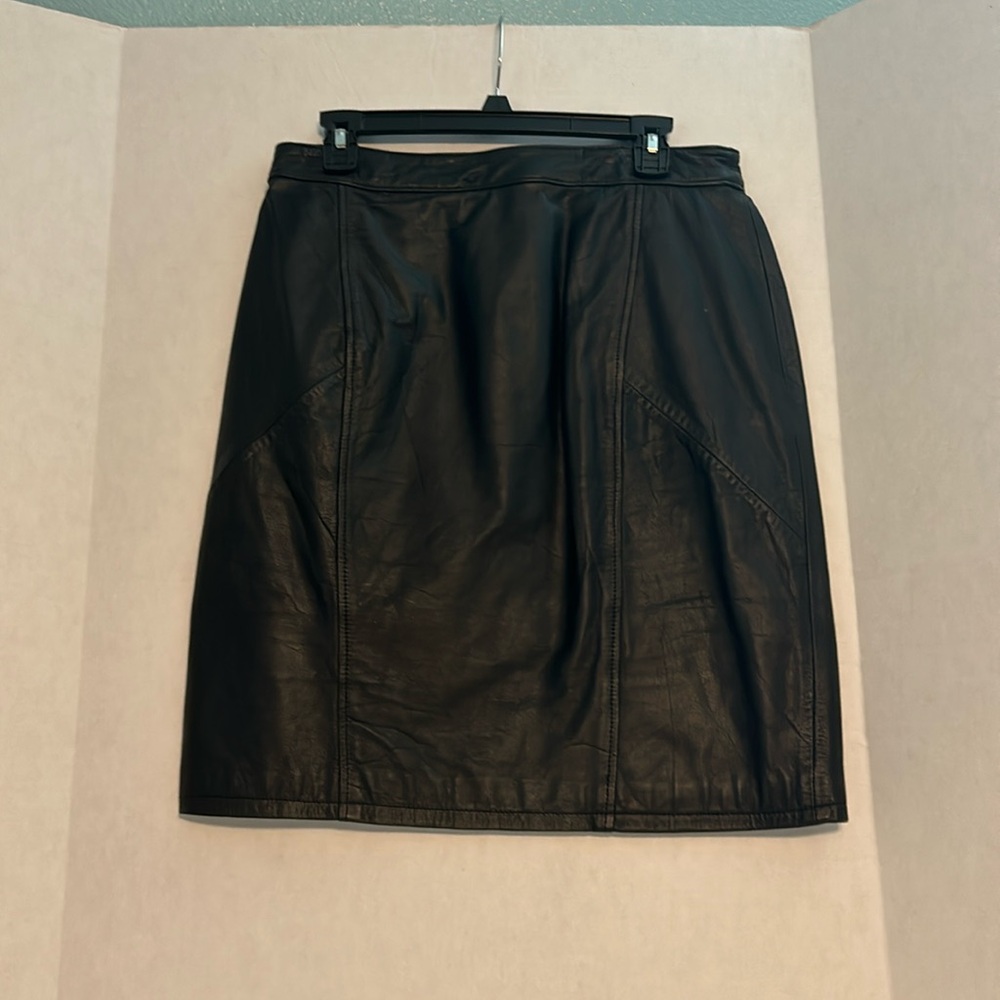 Black leather lined skirt.